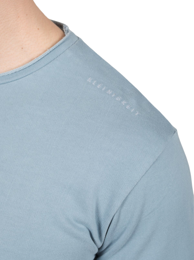 Kleinigkeit T-Shirt Leonardo Dikaputtio bei Robert Ley